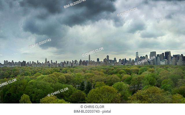 Urban park and city skyline, New York, New York, United States