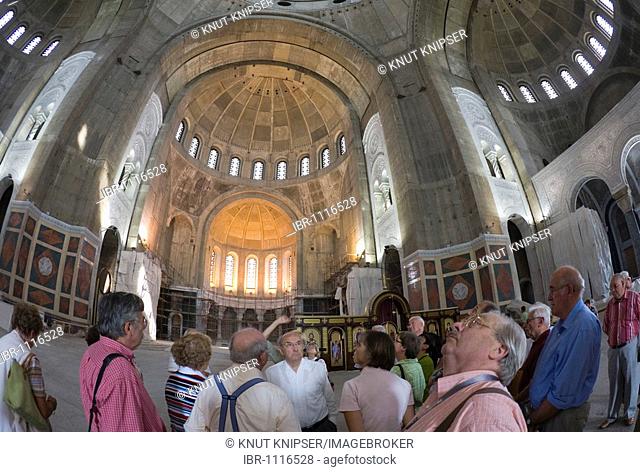 Tourists in the Saint Sava Cathedral during construction work, Belgrade, Serbia
