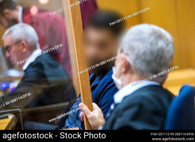 12 November 2020, Hessen, Frankfurt/Main: The joint plaintiff Ahmed I. (M) is waiting for the beginning of another session of the murder trial in the Lübcke...