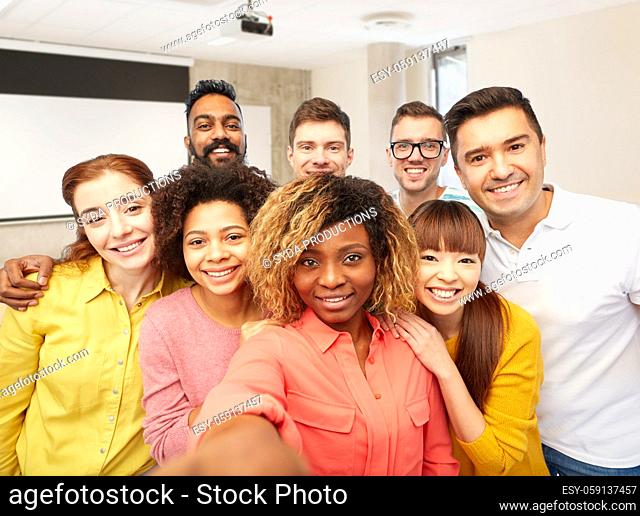 international students and teacher taking selfie