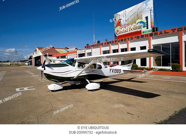 Airport with Cessna airplane parked outside the main terminal at Ciudad Bolivar city airport