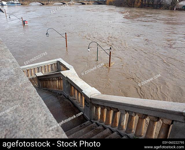 Street Lamp on Murazzi bank of River Po submerged in water due to flood in city centre in Turin, Italy