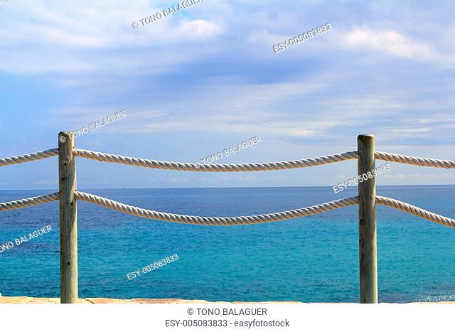banister railing on marine rope and wood