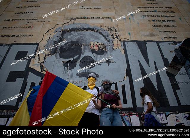Protesters with Colombian flags, participate in the fourteenth day of protests in the context of the national strike called by social sectors against the...