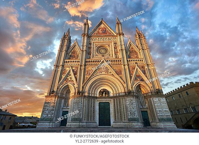 Sunset picture of the 14th century Tuscan Gothic style facade of the Cathedral of Orvieto, designed by Maitani, Umbria, Italy