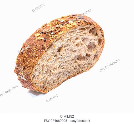 Whole grain bread Slice over white background, diagonal view with shallow focus