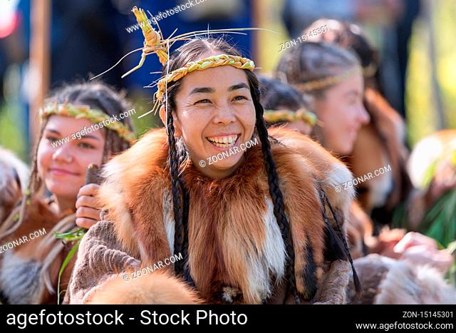 Portrait expression young woman in clothing indigenous people of Kamchatka Peninsula. Alhalalalay - Itelmens national ritual festival of thanksgiving nature