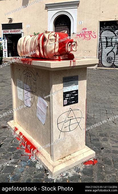 25 June 2021, Italy, Rom: Unknown persons have doused the suckling pig statue in a small square in the popular nightlife district of Trastevere with red paint