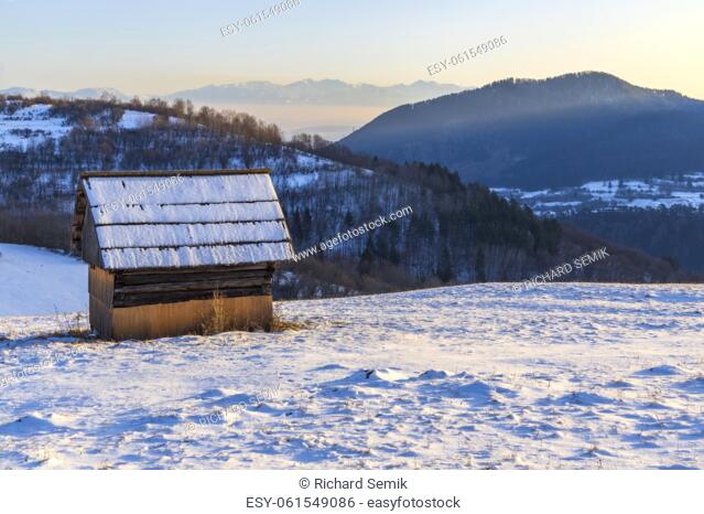 Winter landscape with hayloft in Velka Fatra, Slovakia