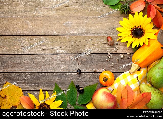 Autumn background on wooden table. Copy space. Top view