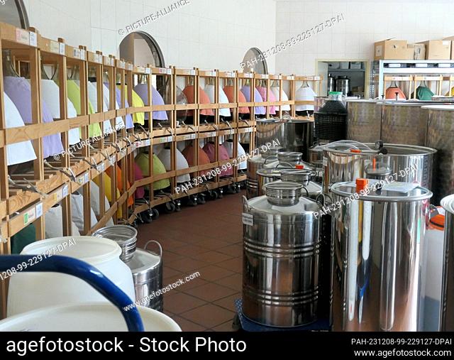 30 August 2023, Austria, St. Gilgen: Many containers stand in one room, in the European monastery Gut Aich in St. Gilgen on Lake Wolfgang in the Salzkammergut...