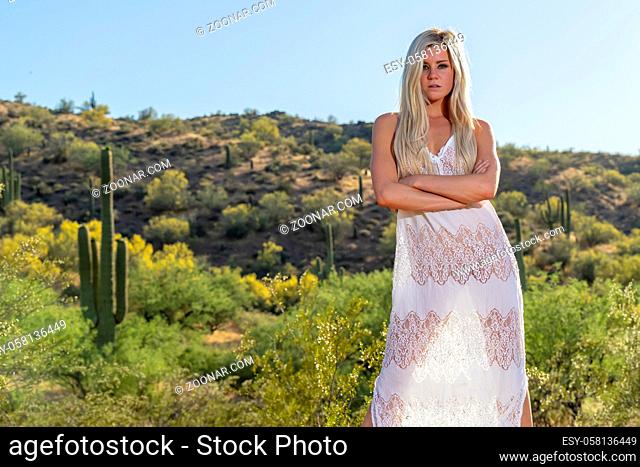 A gorgeous young blonde model enjoys a summer day in the Arizona Desert