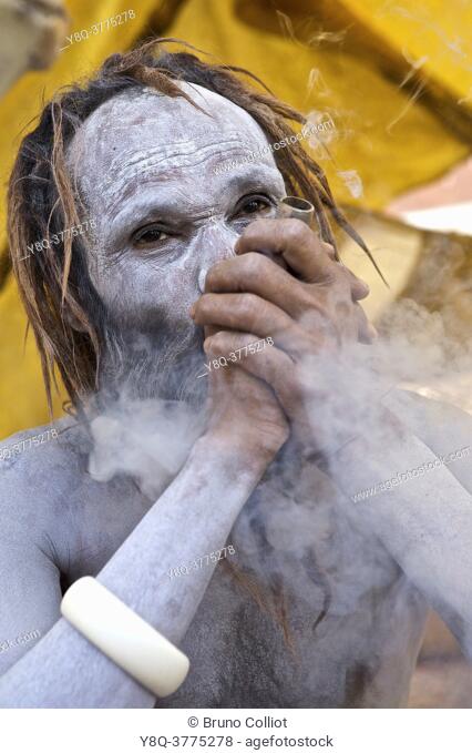 naga baba encampment on the ghats in benares, smoking shilom while awaiting shivaratri. UP, india