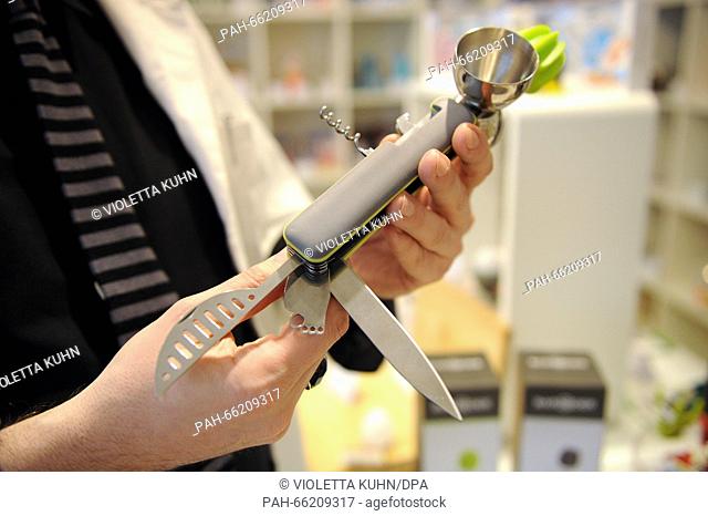 'Inventor Shop' owner Marijan Jordan presenting a Swiss knife for bartenders in his shop in Berlin, Germany, 24 February 2016