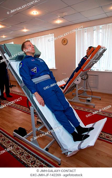 At the Cosmonaut Hotel crew quarters in Baikonur, Kazakhstan, Expedition 46-47 crewmember Tim Kopra of NASA took a turn on a tilt table to test his vestibular...