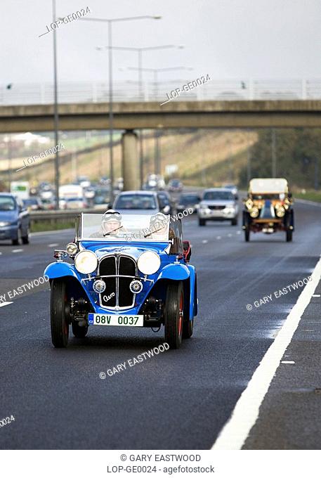 England, City of Brighton and Hove, Brighton. Participants in the London to Brighton veteran car run on the A23 approaching Brighton