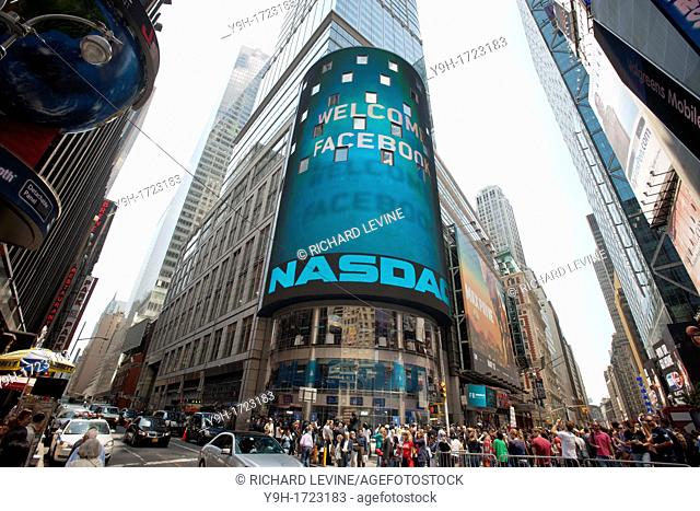 The media and the curious congregate outside of NASDAQ headquarters in Times Square in New York on Friday, May 18, 2012 for the debut of the Facebook IPO The...