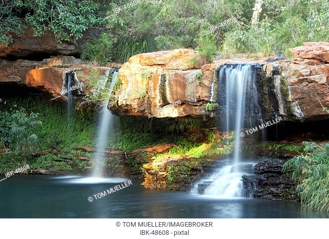 Waterfall at Fern Pool in morning light Dales Gorge Karijini National Park Pilbara region western australia WA