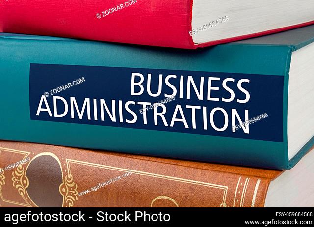 A book with the title Business Administration written on the spine