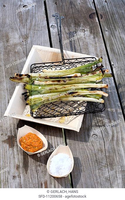 Grilled spring onions with pepper salsa