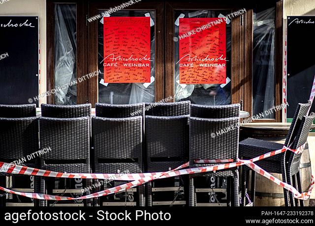 Tables and chairs in front of a closed bar in the citycenter of Oldenburg (Germany), 23 February 2021. - Oldenburg/Niedersachsen/Deutschland