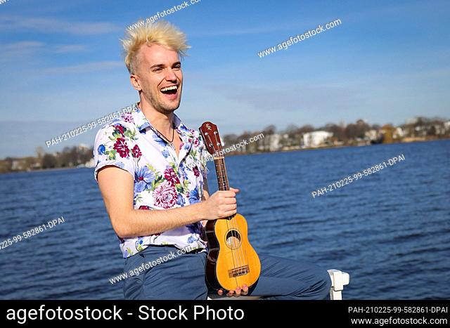 24 February 2021, Hamburg: Jendrik Sigwart, singer and musical performer, smiles during a photo session at the Alster. Sigwart will present the official German...