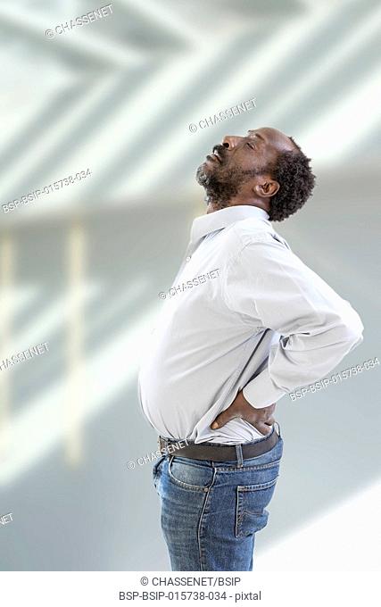 A man suffering from lower back pain
