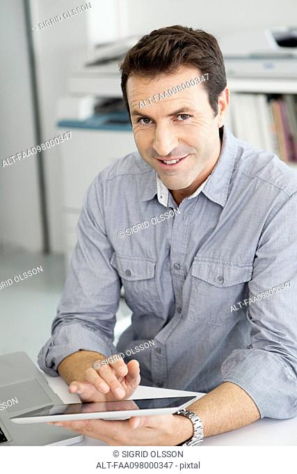 Office worker using digital tablet