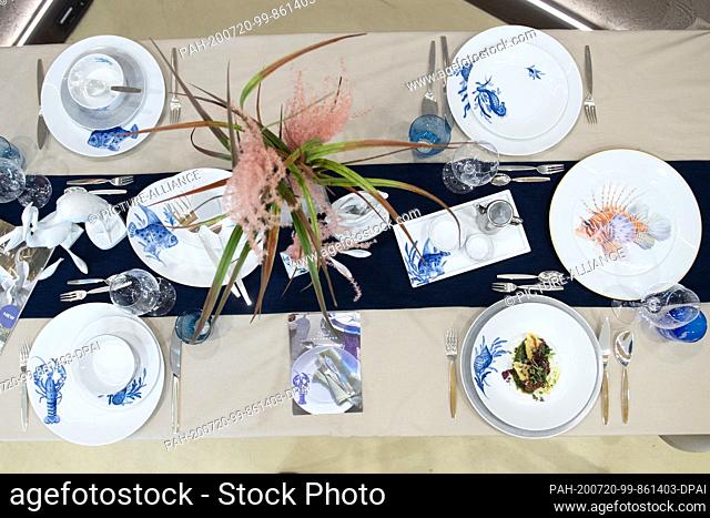 20 July 2020, Saxony, Dresden: Plates and bowls from the ""Meissen Blue Treasures"" service are placed on a laid table on the fringes of a press event