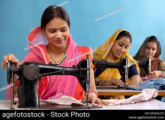 A group of rural women working on sewing machines