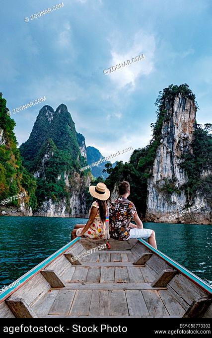 couple on longtail boat visiting Khao Sok national park in Phangnga Thailand, Khao Sok National Park with longtail boat for travelers, Cheow Lan lake