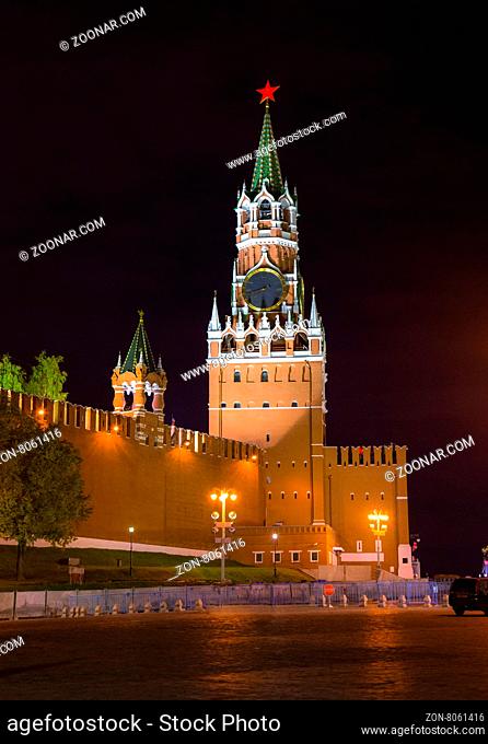 Night view of Spasskaya Tower of the Moscow Kremlin and wall of the Kremlin with illumination and streetlights