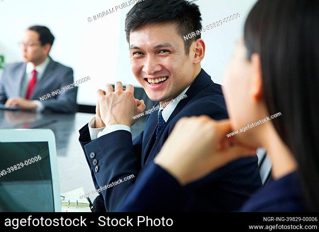 Businessman Smiling and Looking at Camera