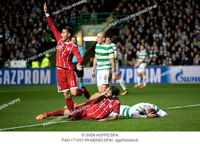 The injured scorer Javi Martinez lies on the ground after the 1-2 goal during the Champions League football match between Glasgow's Celtic FC and FC Bayern...