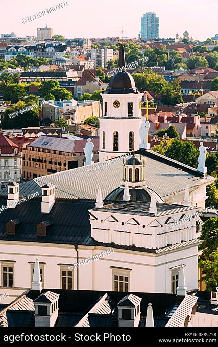 Vilnius, Lithuania. View Of Bell Tower Chapel, Angels On Roof Of Cathedral Basilica Of St. Stanislaus And St. Vladislav And Palace Of Grand Dukes Of Lithuania