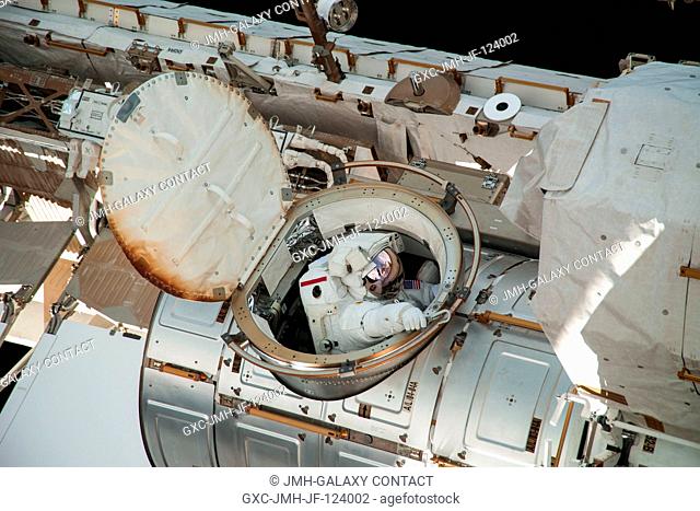 NASA astronaut Chris Cassidy, Expedition 36 flight engineer, exits the Quest airlock for a session of extravehicular activity (EVA) as work continues on the...
