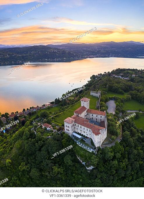 View of the fortress called Rocca di Angera during a spring sunset. Angera, Lake Maggiore, Varese district, Lombardy, Italy