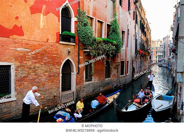 two gondoliers negotiating a narrow canal in Venice, Italy, Venice, Venice