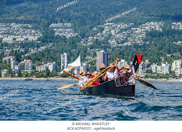 Salish First Nations canoes leaves Ambleside Beach, West Vancouver at Many People, One Canoe. Salish First Nations, Gathering of Canoes to Protect the Salish...