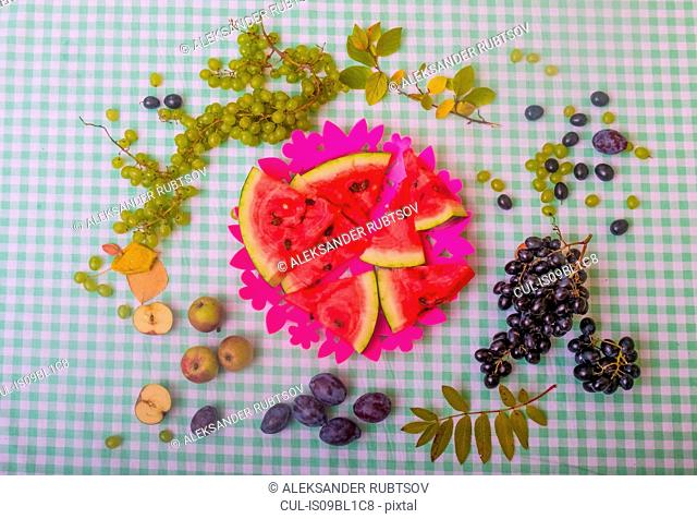 Black and white grapes, plums, apples and watermelon slices