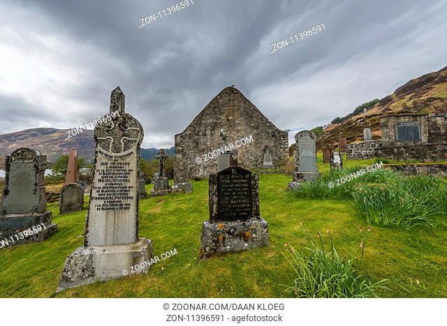 Ault A Gruinn, Scotland - May 7, 2015: Graveyard and Chapel in Ault A'Gruinn in the Highlands of Scotland with lake, snow and piles of stone, image Daan Kloeg