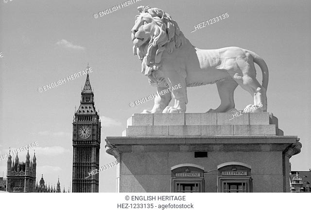 Coade lion, Westminster Bridge Road, Lambeth, London, 1966. Detail of the Coade stone lion on Westminster Bridge with the clock of Big Ben in the background