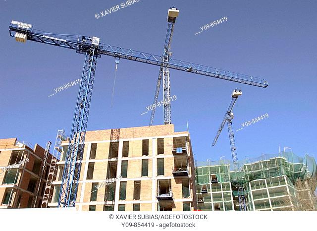 Cranes in a construction site, Barcelona. Catalonia, Spain