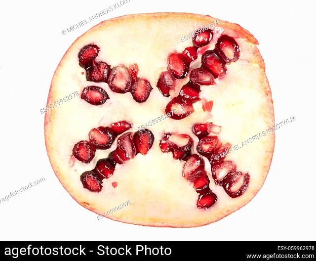 Slice of pomegranate isolated on a white background