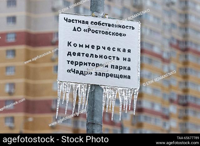 RUSSIA, ROSTOV-ON-DON - DECEMBER 12, 2023: A view of a private property sign covered in glaze ice during freezing rain in winter