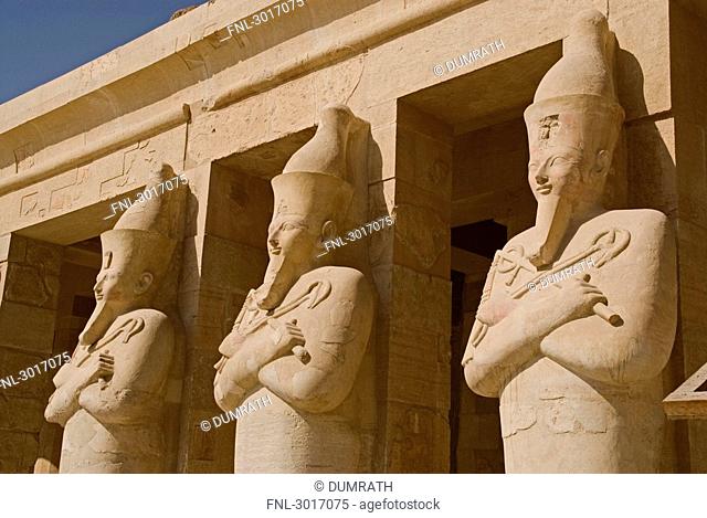 Statues at the pillars of the Temple of Hatshepsut, Luxor, Egypt