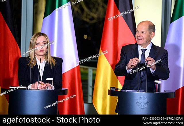 03 February 2023, Berlin: German Chancellor Olaf Scholz (r, SPD) and Giorgia Meloni, Prime Minister of Italy, make remarks at a press conference after their...