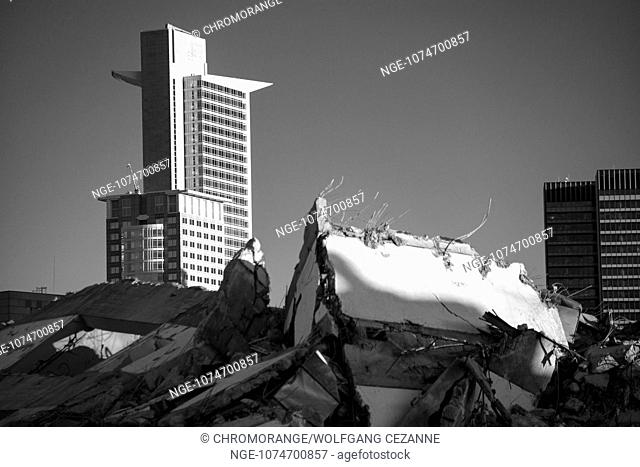 Ruins of the University Tower after Blasting with Skyscraper in Background