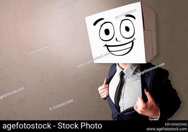 Young boy standing and gesturing with a cardboard box on his head
