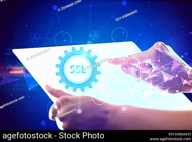 Hand holdig futuristic tablet with SSL inscription, modern technology concept